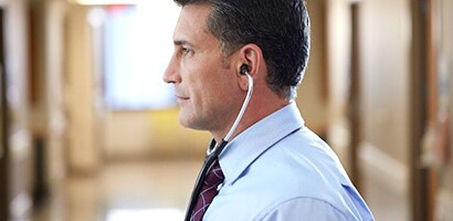Doctor wearing his Littmann stethoscope correctly with eartips facing forward.

